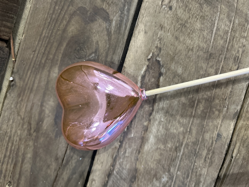 Pink heart on a stick